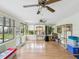 Bright sunroom with hardwood floors, plenty of windows, and natural light at 11762 Barb Ct, Seminole, FL 33778