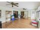 Comfortable sunroom with hardwood floors, a chair, and access to the backyard at 11762 Barb Ct, Seminole, FL 33778