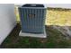 Amana-branded air conditioning unit situated outside next to the home's exterior wall at 135 Emerald Ln, Largo, FL 33771