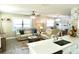 Stylish living space with hardwood flooring, comfortable seating, and farmhouse accents at 135 Emerald Ln, Largo, FL 33771