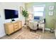 Comfortable home office with computer, modern decor, natural light, and ample workspace at 135 Emerald Ln, Largo, FL 33771