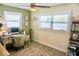 Cozy home office with natural light, desk, computer, chair, and stylish decor at 135 Emerald Ln, Largo, FL 33771