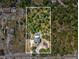 Aerial shot showcasing a home with a pool, surrounded by greenery and clearly marked property lines at 15420 Aubrey Ave, Spring Hill, FL 34610