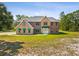 Spacious two-story home featuring well-manicured landscaping and ample curb appeal at 15420 Aubrey Ave, Spring Hill, FL 34610