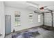 Spacious garage with natural light, windows, and attached door at 15420 Aubrey Ave, Spring Hill, FL 34610