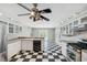 Bright kitchen with checkerboard floors, stainless appliances, and access to the outdoor pool at 15420 Aubrey Ave, Spring Hill, FL 34610