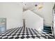 Inviting living room with high ceilings and classic checkered flooring at 15420 Aubrey Ave, Spring Hill, FL 34610