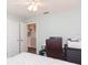 Bright bedroom with a large workspace, neutral color palette, and two closets, offering functionality and ample storage at 17734 Long Ridge Rd, Tampa, FL 33647