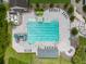 Aerial view of a large community pool with water slide, lap lanes and lounge chairs for relaxing at 17734 Long Ridge Rd, Tampa, FL 33647