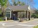 Gated community entrance featuring a stone guard house and well-maintained landscaping at 17734 Long Ridge Rd, Tampa, FL 33647