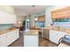 Bright eat-in kitchen with granite counters, stainless appliances and wood-look tile flooring at 17734 Long Ridge Rd, Tampa, FL 33647
