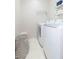 Functional laundry area equipped with a modern washer and dryer, storage, and ample space for sorting and folding at 17734 Long Ridge Rd, Tampa, FL 33647