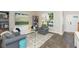 Inviting living room showcases a staircase, hardwood floors, and comfortable seating arrangements at 17734 Long Ridge Rd, Tampa, FL 33647