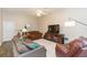 Comfortable living room featuring neutral walls and carpet with recessed lights and ceiling fan at 17734 Long Ridge Rd, Tampa, FL 33647