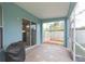 Inviting screened patio with tiled flooring creating a serene outdoor space, accessible from the interior at 17734 Long Ridge Rd, Tampa, FL 33647