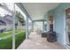Charming screened patio with tiled flooring providing an inviting outdoor space with backyard views at 17734 Long Ridge Rd, Tampa, FL 33647