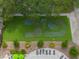 Aerial view of the community putting green near the pool and lounge chairs at 17734 Long Ridge Rd, Tampa, FL 33647