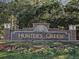 Hunter's Green community sign surrounded by flowers and greenery at 17734 Long Ridge Rd, Tampa, FL 33647