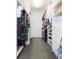 Bright walk-in closet with white shelving and lots of storage space at 17734 Long Ridge Rd, Tampa, FL 33647