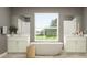 Modern bathroom featuring dual sinks, a standalone tub, and a window with an outdoor view at 18469 Serene Lake Loop, Lutz, FL 33548