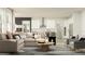 Spacious living room with modern furnishings and open concept design flowing into the kitchen area at 18469 Serene Lake Loop, Lutz, FL 33548