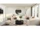 Bright and stylish living room featuring modern seating, decorative pillows, and a unique rug at 18469 Serene Lake Loop, Lutz, FL 33548