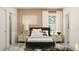 Stylish bedroom with modern bed, decorative wall art, and convenient closet access at 18469 Serene Lake Loop, Lutz, FL 33548