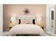 Elegant bedroom with flower wall decor, soft lighting, and neutral tones, creating a peaceful retreat at 18469 Serene Lake Loop, Lutz, FL 33548