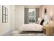 Serene bedroom featuring a comfortable bed, window view, and stylish decor for relaxation at 18469 Serene Lake Loop, Lutz, FL 33548