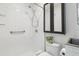 The bathroom features a standing shower, accessible grab bar, sink, toilet, and medicine cabinet at 18914 Geraci Rd, Lutz, FL 33548