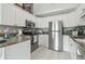 Bright kitchen featuring stainless steel appliances and granite countertops at 18914 Geraci Rd, Lutz, FL 33548