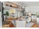 Bright living room features hardwood floors, fireplace, seating area, modern accents, and spiral staircase at 18914 Geraci Rd, Lutz, FL 33548