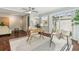 Cozy home office features wood floors, desk, chair, rug, natural light and neutral colors at 18914 Geraci Rd, Lutz, FL 33548
