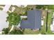 Overhead view of property showing roof, driveway, landscaping, and surrounding neighborhood at 205 Wimbly Pl, Sun City Center, FL 33573