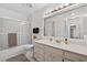 Well-maintained bathroom featuring a shower-tub combination and a large mirror at 205 Wimbly Pl, Sun City Center, FL 33573