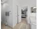Bright bathroom featuring a vanity, walk-in closet and tiled flooring at 205 Wimbly Pl, Sun City Center, FL 33573