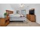 Bedroom is complete with a bed, dresser, nightstand, and sliding doors for natural light at 205 Wimbly Pl, Sun City Center, FL 33573
