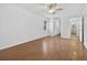 Bedroom with hardwood floors, neutral paint and a large window with a view at 205 Wimbly Pl, Sun City Center, FL 33573