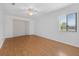 Serene bedroom with hardwood floors and sliding glass doors for natural light at 205 Wimbly Pl, Sun City Center, FL 33573