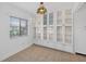 Dining room featuring large glass display cabinets and a window at 205 Wimbly Pl, Sun City Center, FL 33573