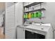 Laundry room has washer, dryer and shelves for storage at 205 Wimbly Pl, Sun City Center, FL 33573