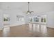Bright living room features neutral paint, vaulted ceiling and large windows that fill the room with natural light at 205 Wimbly Pl, Sun City Center, FL 33573