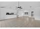 Open-concept living room with tile floors and pass-through to the kitchen at 205 Wimbly Pl, Sun City Center, FL 33573