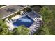 Aerial view of pool with ample seating and bath house surrounded by tropical landscaping at 210 Se 27Th St, Ruskin, FL 33570