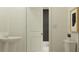 Classic powder room boasting a pedestal sink and toilet with an adjacent doorway at 210 Se 27Th St, Ruskin, FL 33570