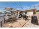 Relaxing backyard patio with outdoor furniture, a grill, and a well-kept stone surface at 2135 Pocahontas Dr, Largo, FL 33774