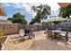 Cozy backyard setting with dining and lounge furniture plus a grill; perfect for outdoor gatherings at 2135 Pocahontas Dr, Largo, FL 33774