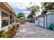 Spacious backyard featuring a gravel area, outdoor seating, and a storage shed at 2135 Pocahontas Dr, Largo, FL 33774