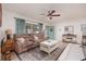 Inviting living room featuring a plush sofa, stylish decor, and a view of the front door at 2135 Pocahontas Dr, Largo, FL 33774