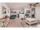 Open-concept living space showcasing the kitchen, dining area, and living room with bright, neutral tones at 2135 Pocahontas Dr, Largo, FL 33774